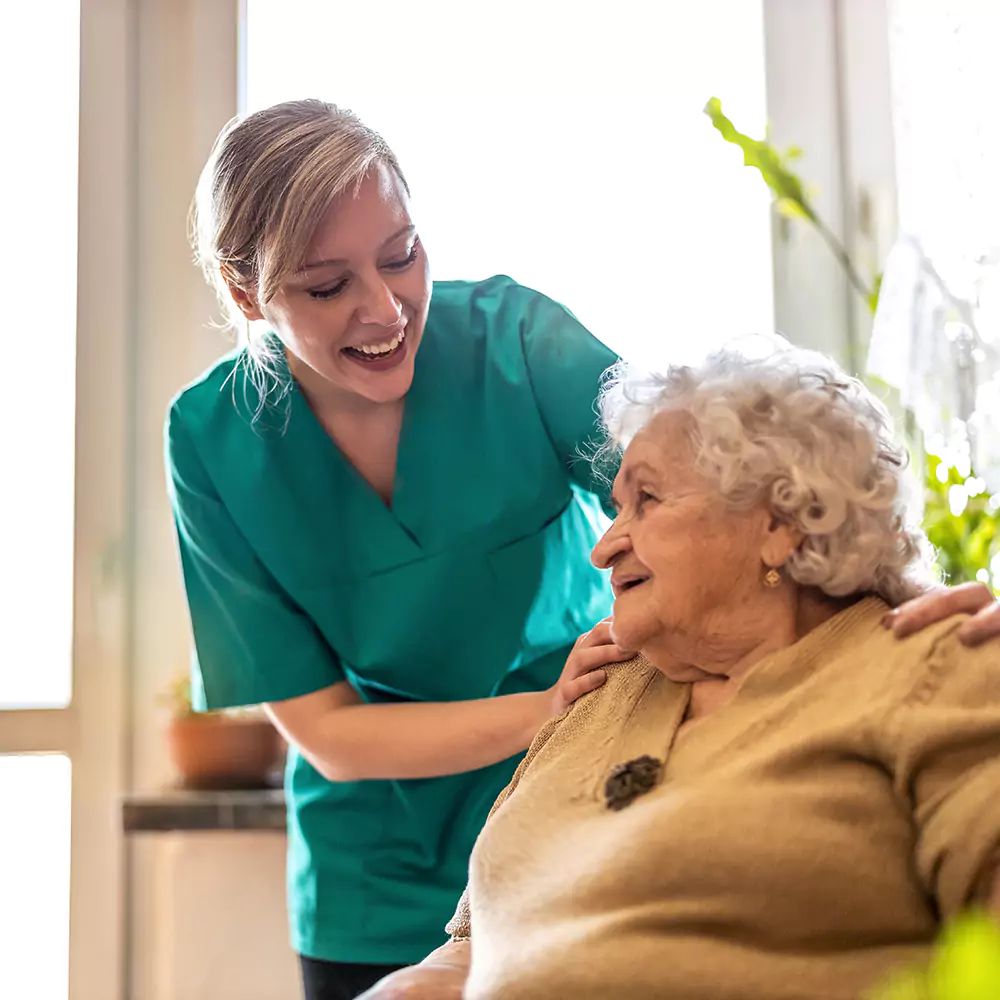 nurse supporting elderly woman with dimentia